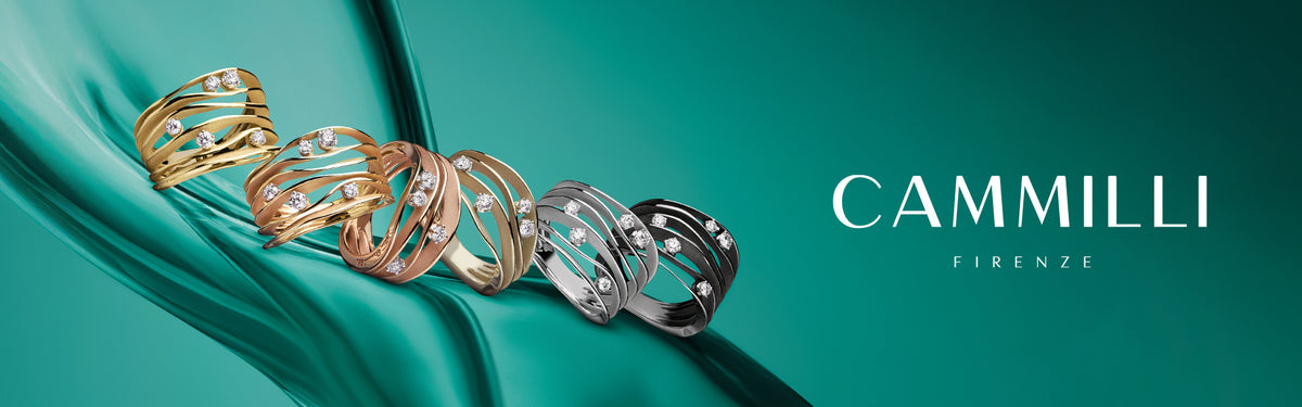 6 Cammilli Firenze rings in different metal colors on a green background with the text "CAMMILLI FIRENZE"